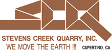 A brown and white logo for the red creek quarry.